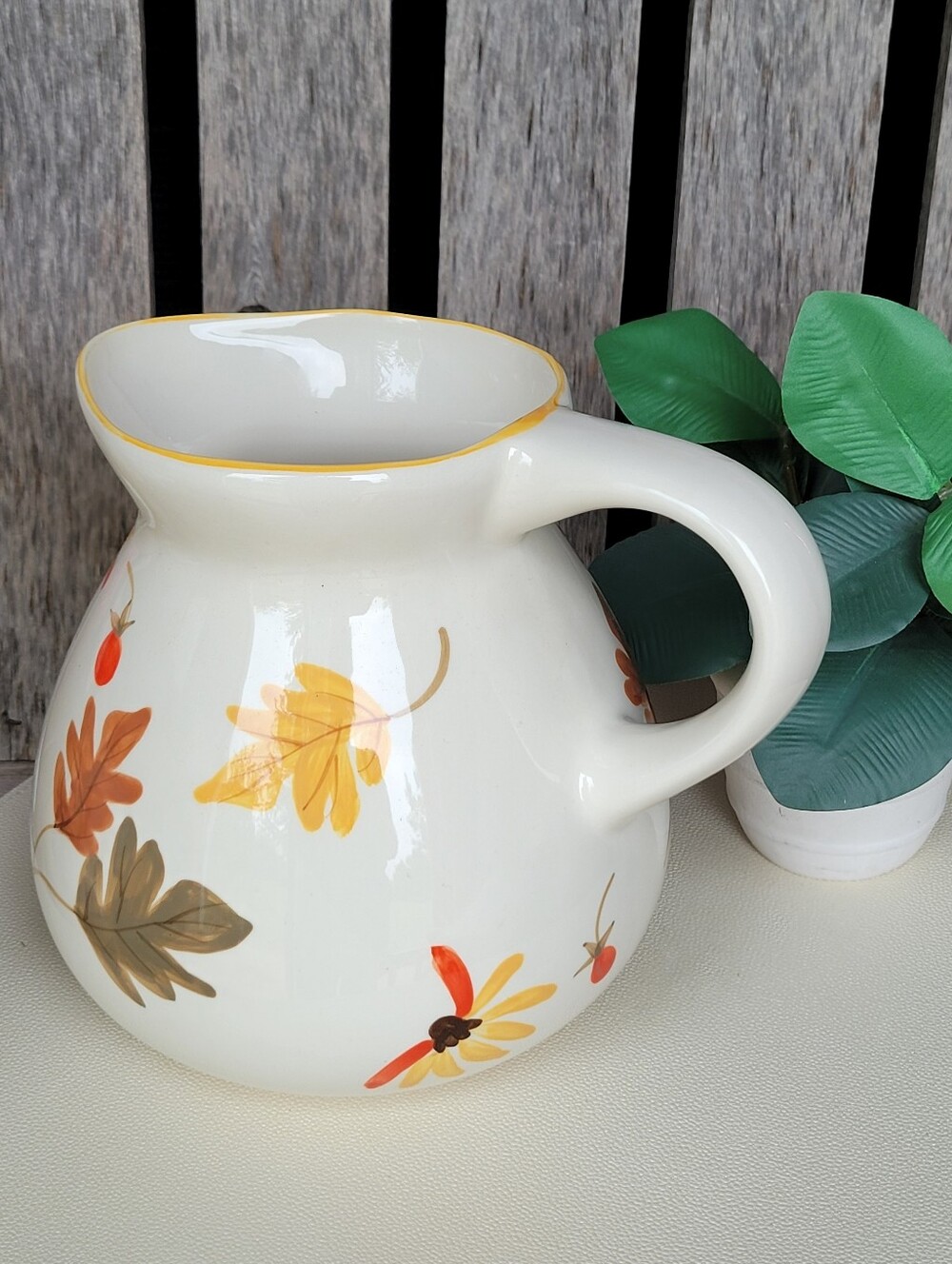 TAG 2004 Hand-Painted Ceramic Pitcher with Yellow Trim and Autumn Leaf Design